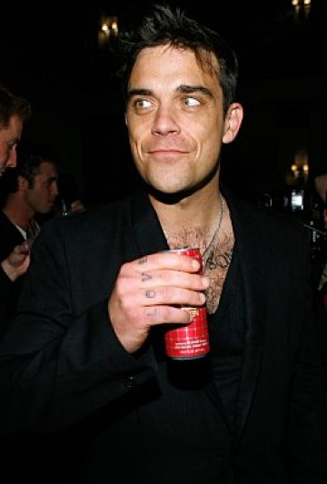 Роби Уилямс напоследък напълно полудя на тема извънземни. А толкова харесвахме музиката му... Снимки: GettyImages/Guliver