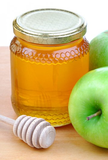 Ябълки и мед за вкусно, пардон, сияйно лице. Снимка: Dreamstime