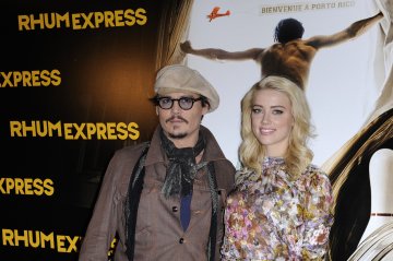 Джони и Амбър; Снимка: Reuters