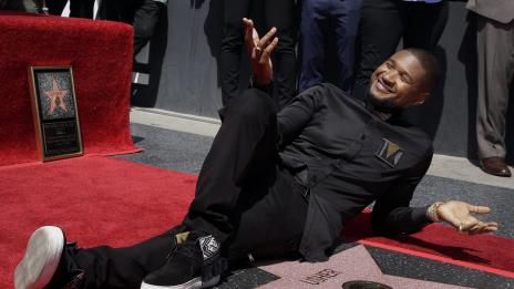 Рапърът Ъшър ще става баща