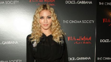 Мадона заплашва Гай