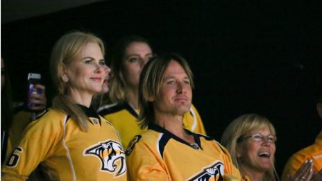 Никол Кидман и Кийт Ърбан като спортни фенове