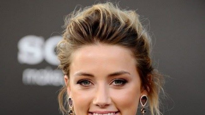 В крачка: Амбър Хърд за ръка с Вито Шнабел