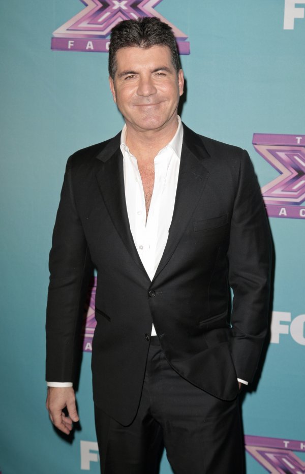 Втора позиция печели продуцентът на музикалното риалити „X Factor" Саймън Коуел. Снимка: Reuters